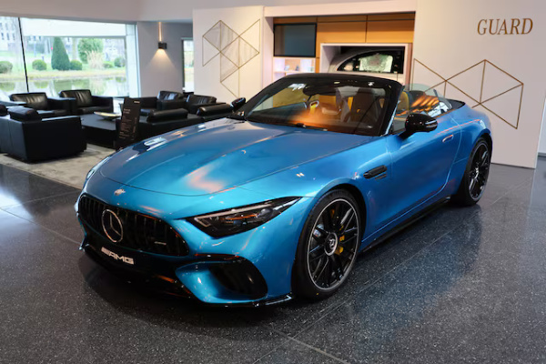 A Mercedes-AMG SL 63 4MATIC+ car is displayed in a showroom at Mercedes-Benz competence center