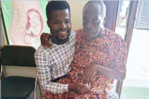 Veteran actor, Kohwe sitting on the laps of an unknown gentleman