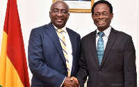 Dr. Mahamudu Bawumia in a handshake with Apostle Onyinah