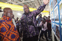 President Akufo-Addo and Railway minister Joe Ghartey inspecting a project on a board