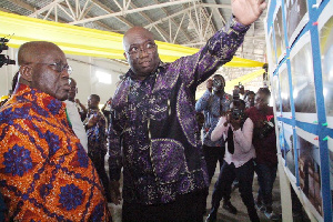 President Akufo-Addo and Railway minister Joe Ghartey inspecting a project on a board