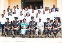 Osei- Assibey Antwi with some police officers and NSS personnel