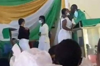 Screengrab of Rev Obeng Larbi kissing one of the girls