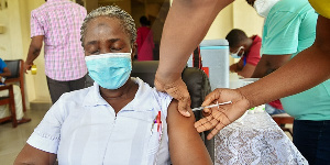 A woman receives her jab at the Korle Bu Teaching Hospital. Credit: [Kobby Blay]