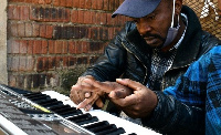 Piano teacher Amisi Mubale volunteers at Safe Study every Saturday to give children the opportunity