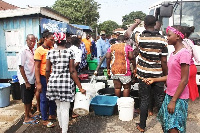 Residents collecting water from a water tanker