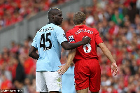 Balotelli in number 45 jersey with Steve Gerrard