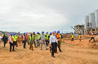 MPs being taken on a tour round Empire Cement by Nana Obokomatta IX (Right)