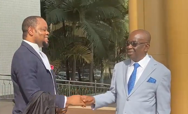 Kan-Dapaah in hearty conversation with Oliver Barker-Vormawor's lawyer, Dr Justice Srem-Sai