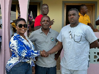 Dorcas Affo-Toffey shakes hands with Francis Ackatia Kwaidoo