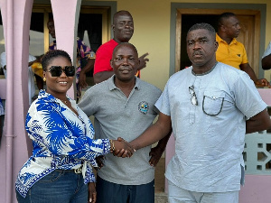 Dorcas Affo-Toffey shakes hands with Francis Ackatia Kwaidoo