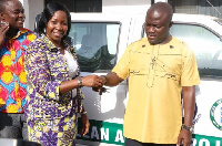 Managing Director of Zoomlion Ghana Mrs. Florence Larbi handing over the car keys to the Accra Mayor