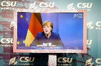 German Chancellor Angela Merkel makes a statement in Berlin on January 7 about riots is DC