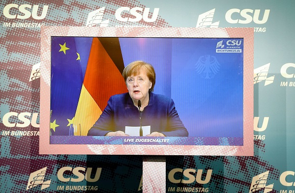 German Chancellor Angela Merkel makes a statement in Berlin on January 7 about riots is DC