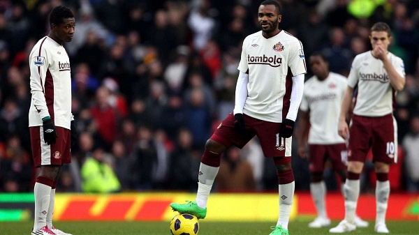 Black Stars striker , Asamoah Gyan with Darren Bent