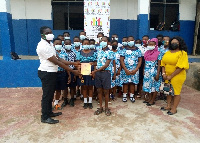 NCCE officer-in-charge, Kwadwo Adu-Asare awards students who participated