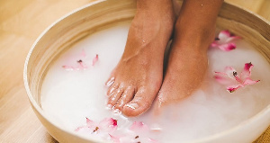 Soak your feet in a solution of warm water and either vinegar or Epsom salt for 20 minutes