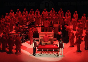 Wearing red hooded sweatshirts, the gospel group opened the service at Brooklyn's Barclays Center.