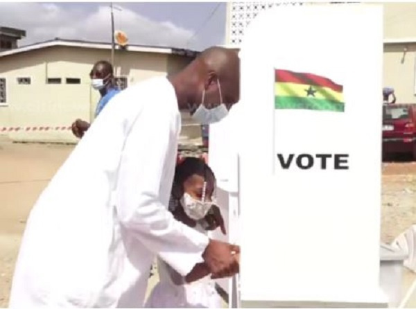 Alhaji Mohammed Muntaka Mubarak with daughter at Peace of God polling station