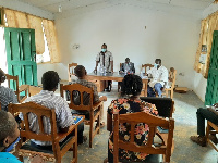 Dr Franklin Avornyo at the extreme end addressing participants at the programme