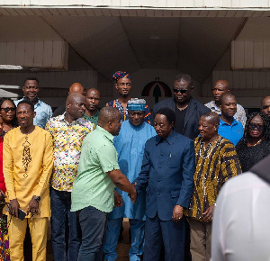 Dr Duffuor in a handshake with Nii Ashie Moore after his visit