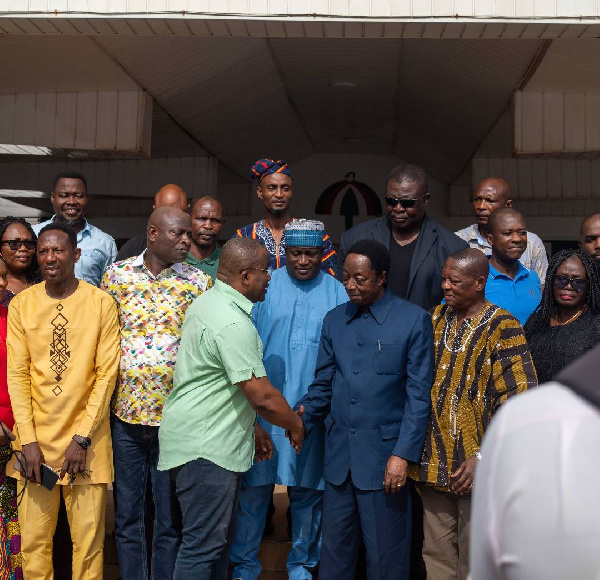 Dr Duffuor in a handshake with Nii Ashie Moore after his visit