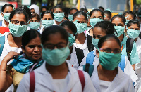 Indian nursing students wearing masks at the government-run Gandhi Hospital. Credit: Bloomberg