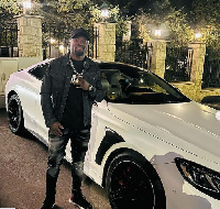 Tekpetey poses in front of his new ride