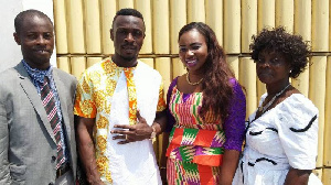 Banahene with his new bride flanked by family members