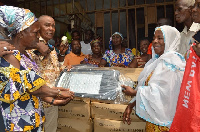 Boniface Sadique donating the street lights to the market queen