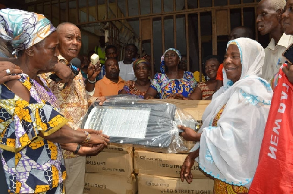 Boniface Sadique donating the street lights to the market queen