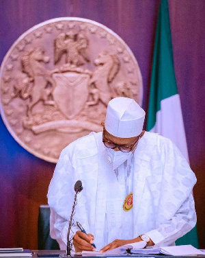 President Muhammadu Buhari signing the Electoral Amendment Bill into law