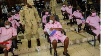 Hotel Rwanda' hero Paul Rusesabagina (centre) and co-detainees in a court room Kigali, Rwanda