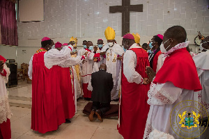 President Akufo-Addo flanked by some men of God