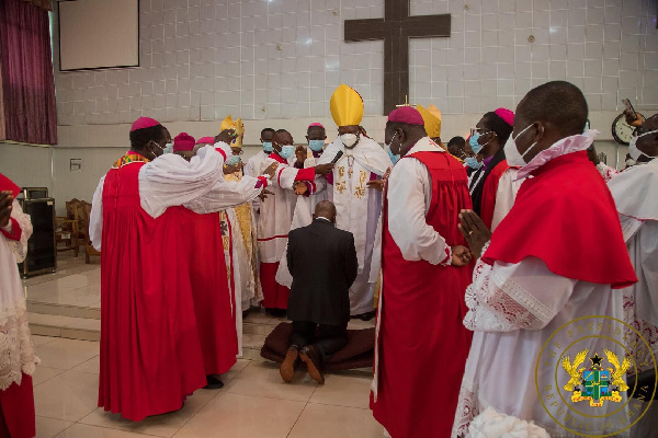 President Akufo-Addo flanked by some men of God