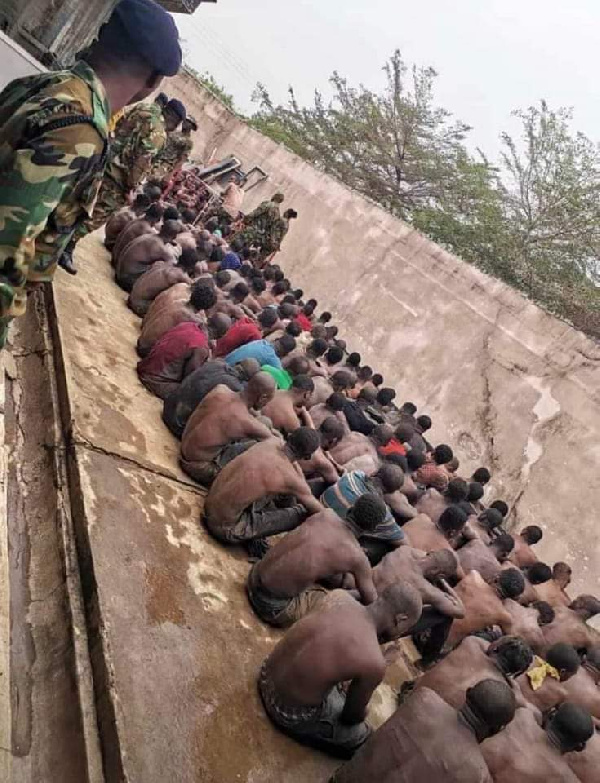 Some residents of Ashaiman lined up after a military swoop