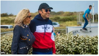 On di night before election Mr Macron and e wife Brigitte stroll go beach