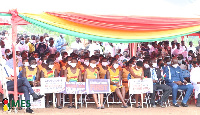 Some of the beneficiaries with the placards at event