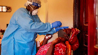 A health official takes a sample from a woman in Juba | ALEX McBRIDE | AFPa