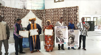 Reverend Alhassan Akwaka and wife in a pose with members of Alpha International Theological Seminary