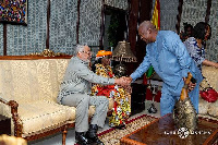 Mahama exchanges pleasantries with the Rawlings'