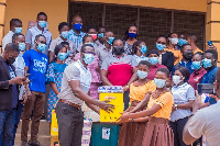 President of GRASAG-UCC, Eric Adjei presents items to Students