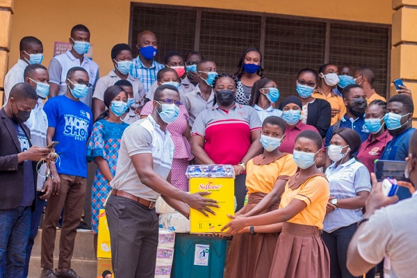 President of GRASAG-UCC, Eric Adjei presents items to Students