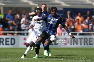 Felix Afena-Gyan (in white jersey) tries to win the ball from an opponent