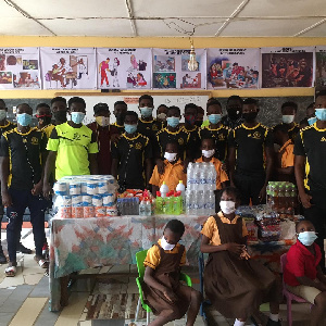 Feiles Football Club making donation to Madina Demonstration Special School