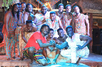 A group picture of members of Okyeman Cultural Ensemble and Womba Africa at a show in 2018