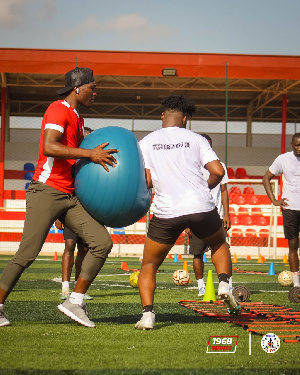 Totti Laryea on the field with some players