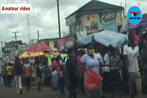 Commuters and traders going about their usual routine