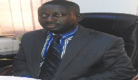 Michael Wilberforce Osae,  General Manager of Amantin and Kasei Community Bank