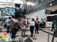 Travelers in queue to check in at the airport